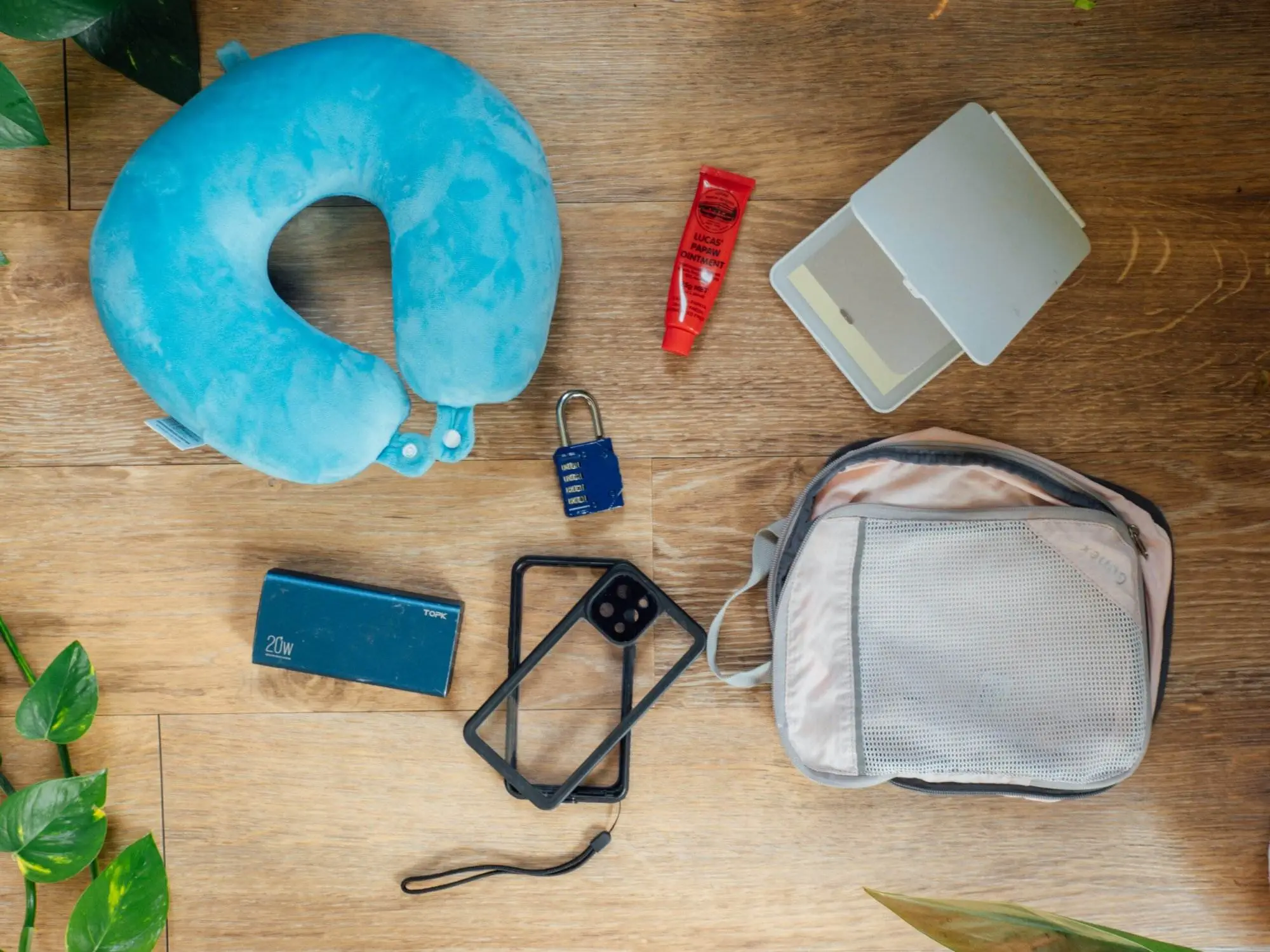 30 essentials for backpacking, neck pillow, portable charger, travel mirror, padlock
